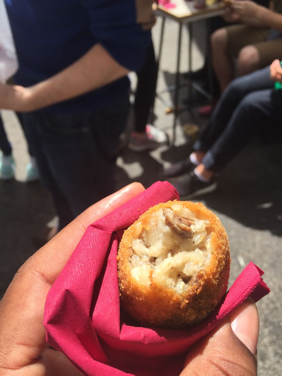 This is a Roman delicacy called Suppli, it is fried rice balls cooked in meat broth. It is unbelievably good when it is hot, and a small place called Trapizzino makes the best kind.